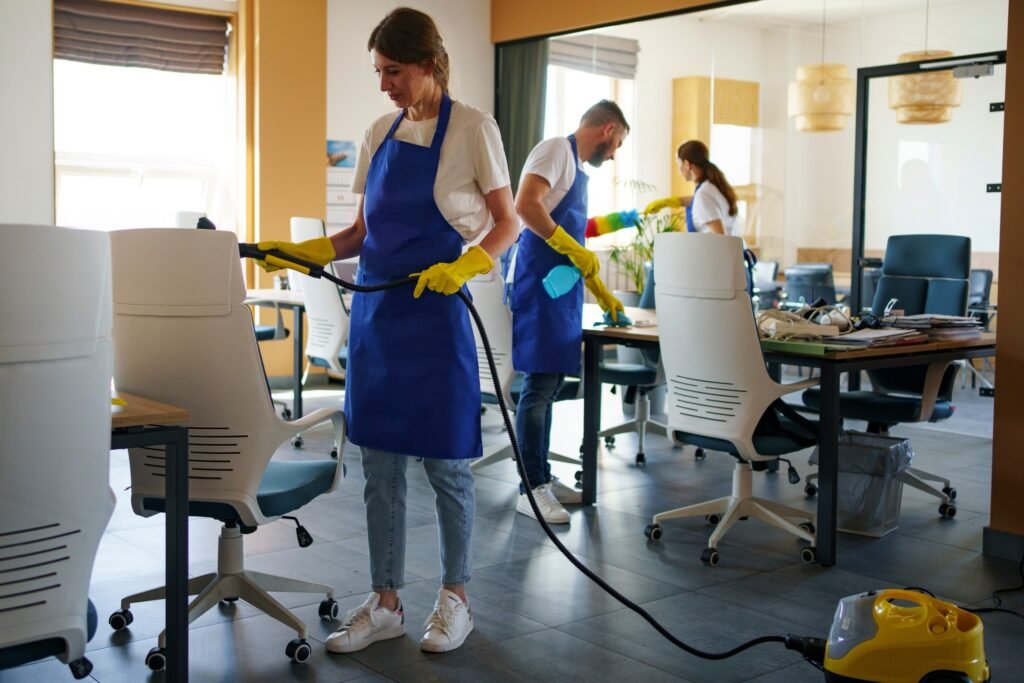 professional-cleaning-service-person-using-vacuum-cleaner-office (1) (1) (1)